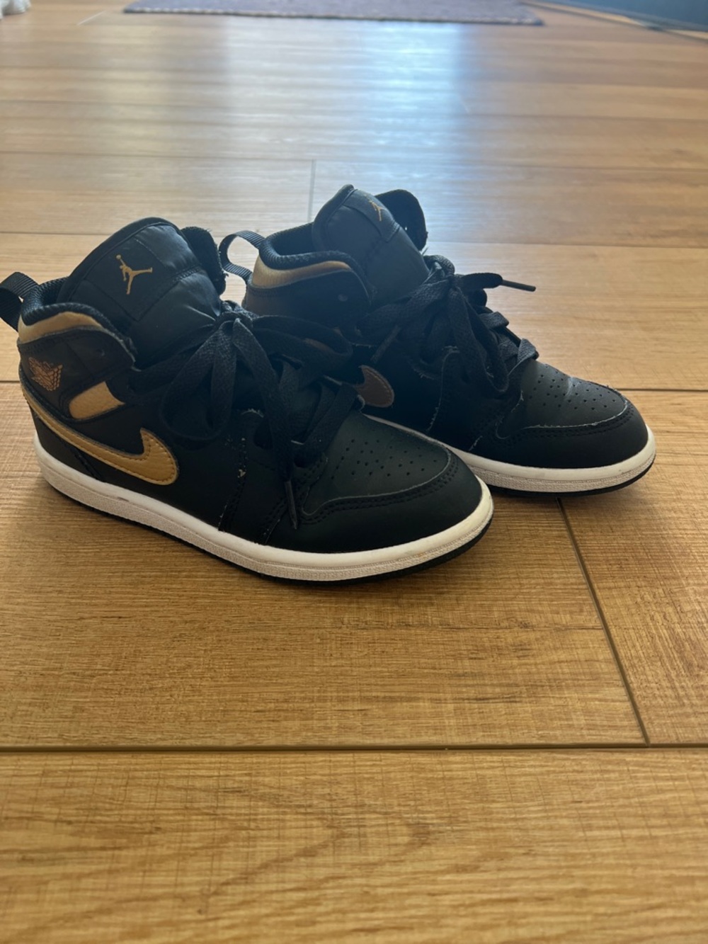 Jordan Kids Black and Gold High-Top Sneakers